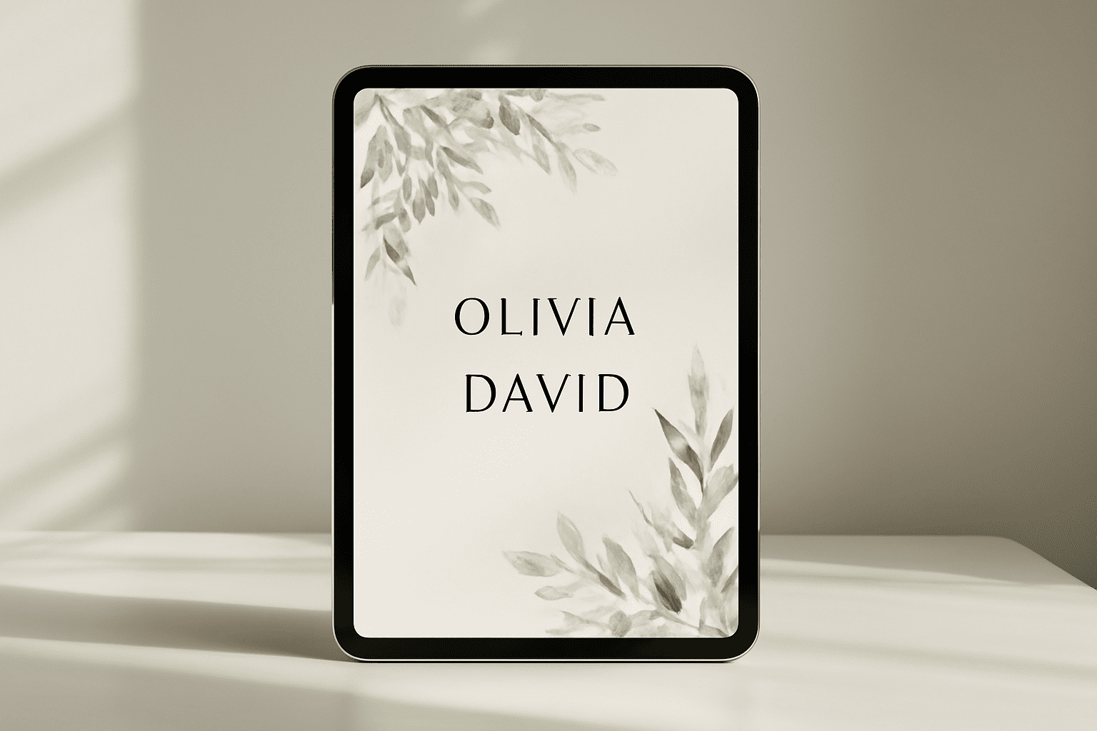 Un faire-part de mariage digital élégant affiché sur un écran moderne dans un cadre minimaliste.
